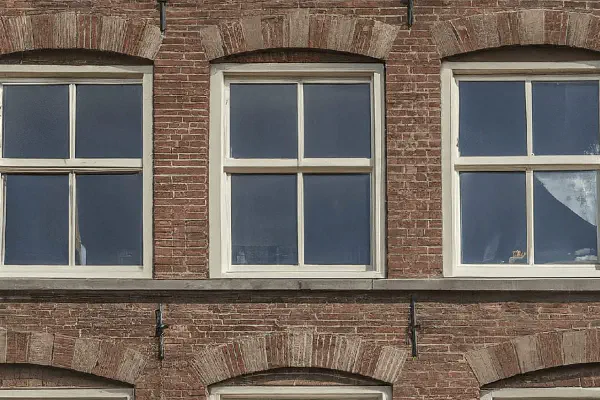 Typical Dutch building facade representing secure real estate investment.